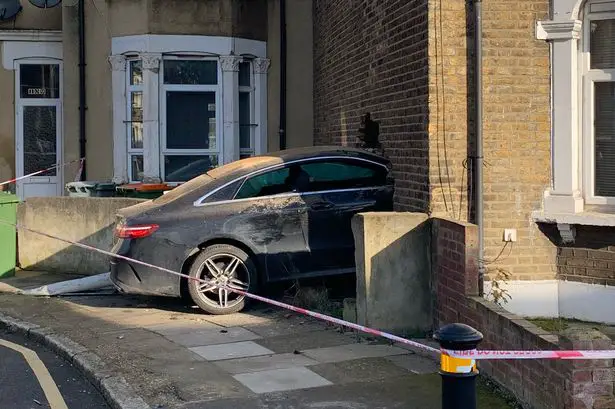 Man arrested after car smashes through side of East London home