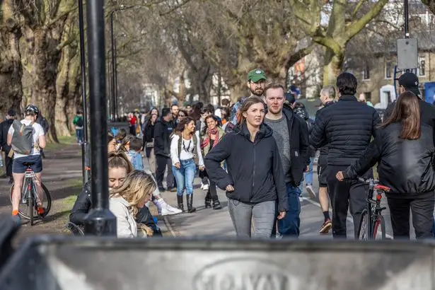 London Fields busy as locals look to make most of warmer weather