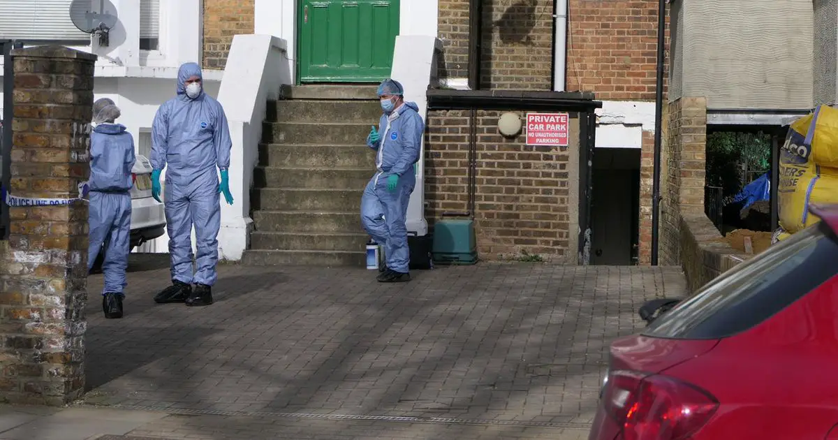 First pictures of investigators on the scene in Ealing where woman was found dead