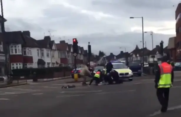 Video shows 'Tesco worker' wrestle knifeman who 'tried to stab police officer' in Harrow