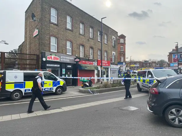 The area outside White Hart Lane overground station in Tottenham is cordoned off after a stabbing