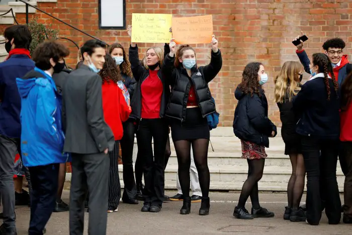 Pupils holding placards outside Highgate School